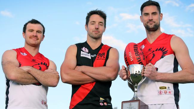 Morphett Vale star Michael Smith (middle) with Flagstaff Hill champions Michael Shearer (left) and David Kearsley. Picture: Dean Martin