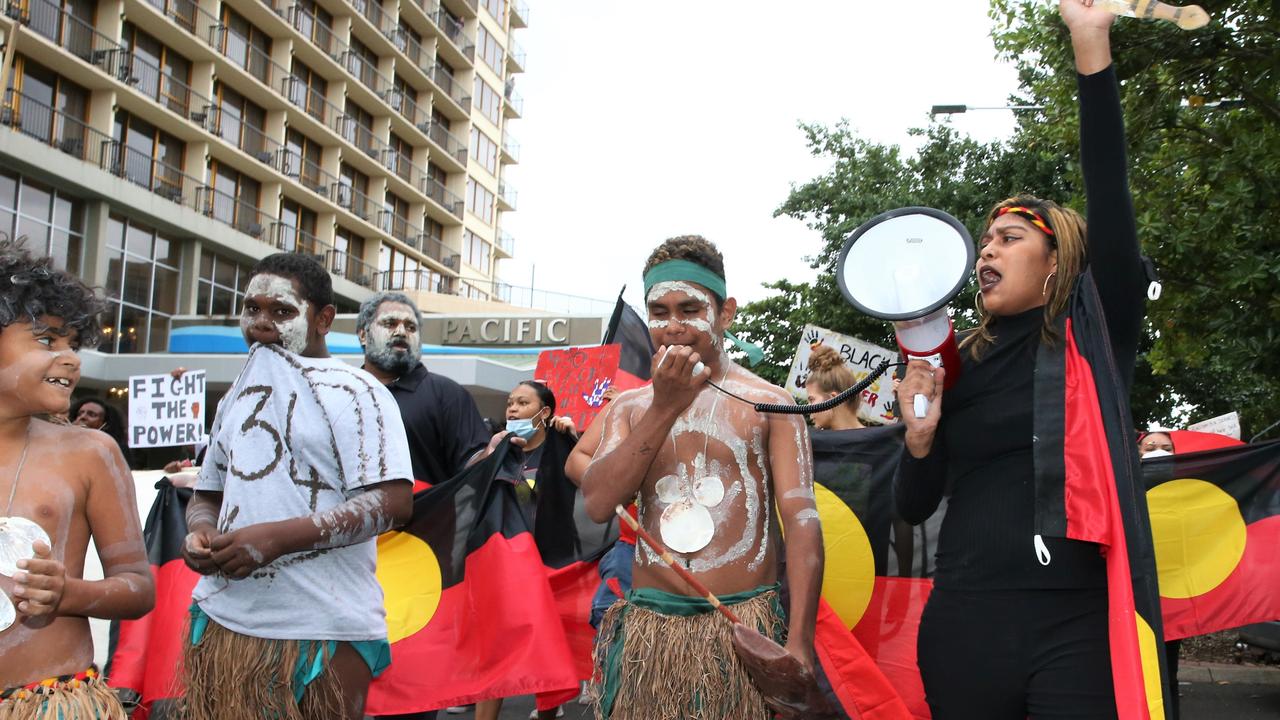 Djarracarne Neal leads a Cairns CBD march in support of the Black Lives Matter movement. Picture: PETER CARRUTHERS