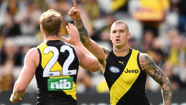 Josh Caddy goes to high five Dustin Martin after a goal. Picture: Getty Images