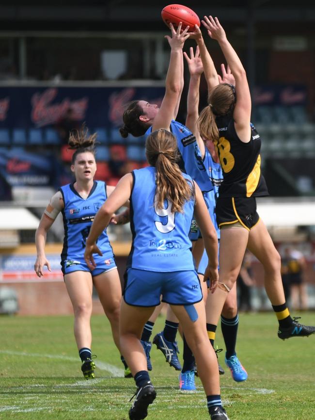 Sturt's Larissa Schenscher going up for a mark against Glenelg's Lucy Bellinger. Picture: Peter Swan