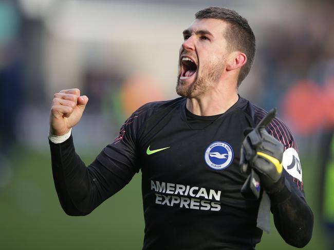 Brighton's Australian goalkeeper Mathew Ryan celebrates after Brighton win the penalty shoot-out after the English FA Cup quarter-final football match between Millwall and Brighton and Hove Albion at The Den in south London on March 17, 2019. - Brighton won the penalty shoot-out 5-4 after the game ended 2-2 after extra time. (Photo by Daniel LEAL-OLIVAS / AFP) / RESTRICTED TO EDITORIAL USE. No use with unauthorized audio, video, data, fixture lists, club/league logos or 'live' services. Online in-match use limited to 120 images. An additional 40 images may be used in extra time. No video emulation. Social media in-match use limited to 120 images. An additional 40 images may be used in extra time. No use in betting publications, games or single club/league/player publications. /