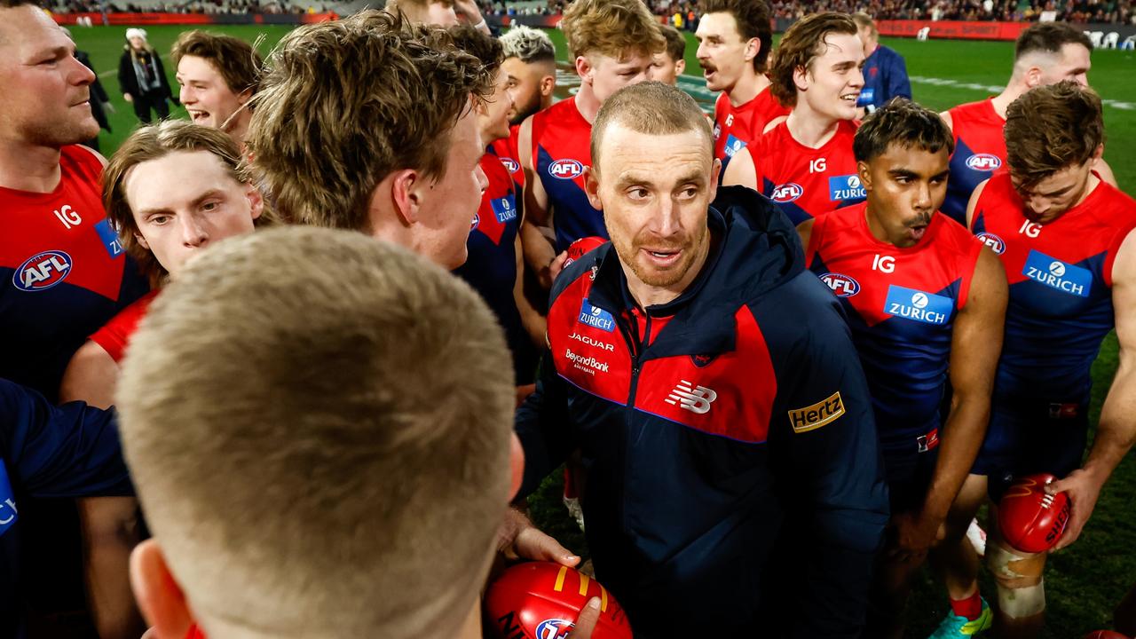 MELBOURNE, AUSTRALIA - JULY 14: Simon Goodwin, Senior Coach of the Demons celebrates with his players during the 2023 AFL Round 18 match between the Melbourne Demons and the Brisbane Lions at the Melbourne Cricket Ground on July 14, 2023 in Melbourne, Australia. (Photo by Dylan Burns/AFL Photos via Getty Images)