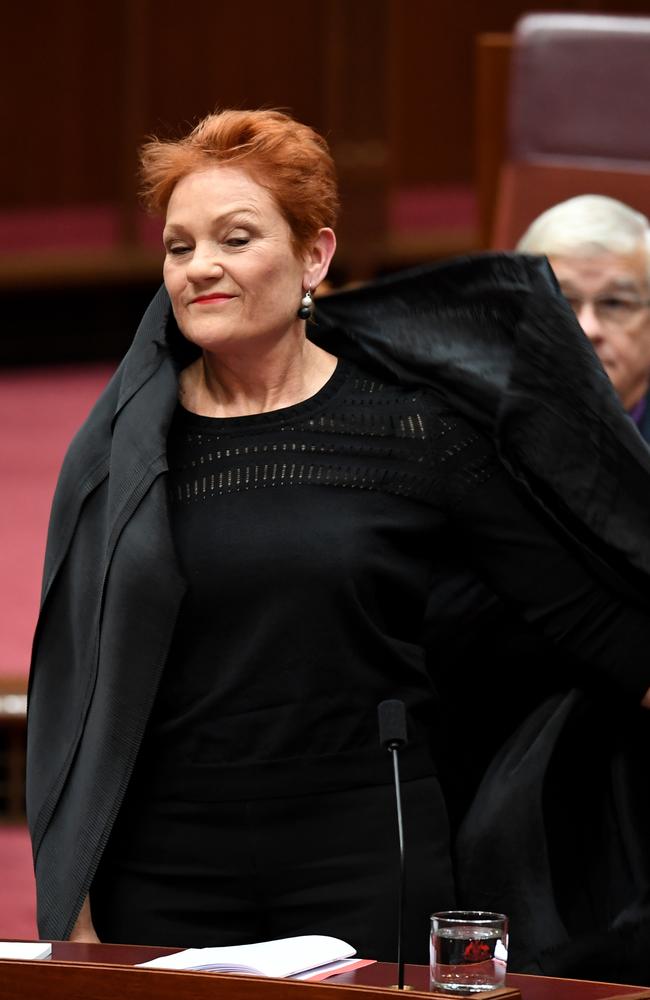 Hanson emerges after taking off the burqa. Picture: AAP