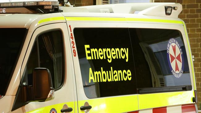 NSW Ambulance paramedics rushed to the scene on Friday afternoon. Photo: Bill Hearne