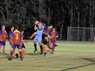 KSS Jets goalkeeper Tim Murray leaps high to stop the cross from the corner. Picture: Brendan Bowers