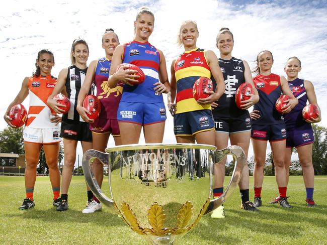 AFLW team captains: Amanda Farrugia for GWS, Steph Chiocci for Collingwood, Emma Zielke for Brisbane Lions, Katie Brennan for Western Bulldogs, Erin Phillips for Adelaide Crows, Bri Davey for Carlton, Daisy Pearce for Melbourne and Kara Donnellan for Fremantle with the AFLW trophy. Picture: David Caird