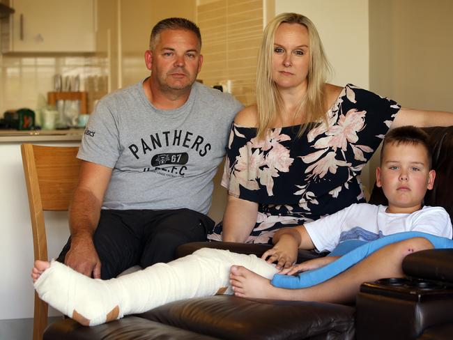 Jack Goodwin (9) at home after breaking his leg at Hilltop Park in Schofieldswith his mum Sally and Dad Dane. Picture: Sam Ruttyn