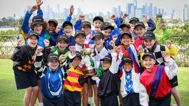 Students from St Margaret’s Primary School Maribyrnong with the Lexus Melbourne Cup at Flemington. Picture: David Caird