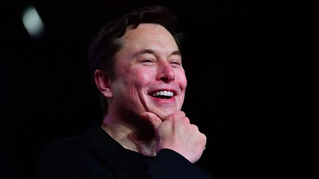 Laughing all the way to the bank … Elon Musk’s 23 per cent stake in Tesla is now worth about $US230bn. Picture: AFP