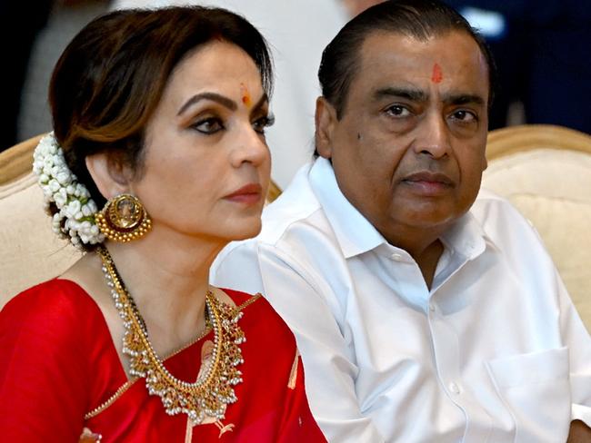 Mukesh Ambani (R) with his wife Nita Ambani. Picture: Punit PARANJPE / AFP