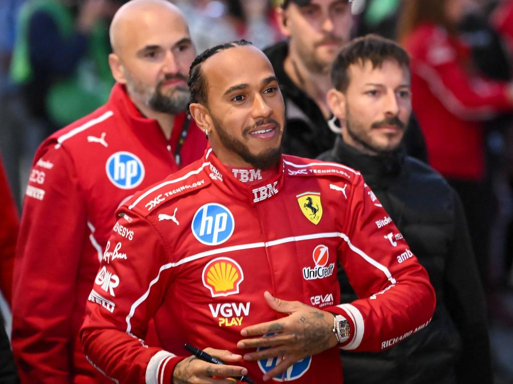 British F1 legend Lewis Hamilton signs autographs during the Scuderia Ferrari HP Drivers' presentation event in Milan, Italy, on March 6. The 2025 Formula One season marks 75 years since the first seven-race championship in 1950. Picture: Piero Cruciatti/AFP