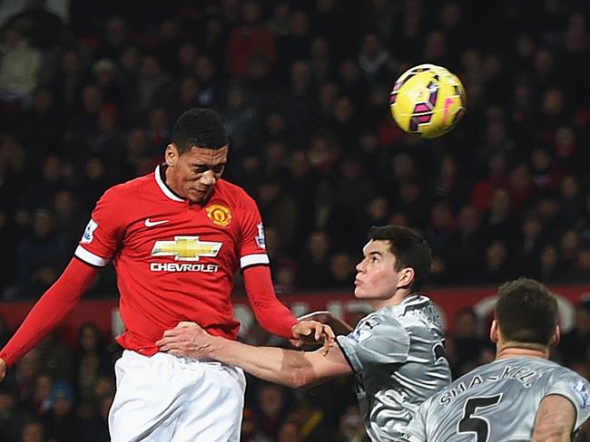 MANCHESTER, ENGLAND - FEBRUARY 11: Chris Smalling of Manchester United scores his second goal during the Barclays Premier League match between Manchester United and Burnley at Old Trafford on February 11, 2015 in Manchester, England. (Photo by Michael Regan/Getty Images)