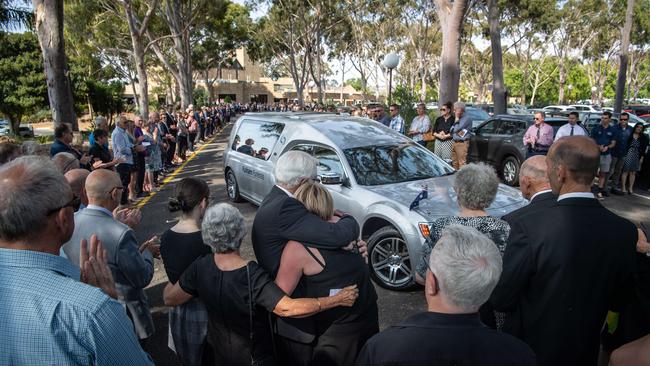 Mourners for an honour guard at Kieran Modra’s funeral at Centennial Park Cemetery. Picture: Brad Fleet