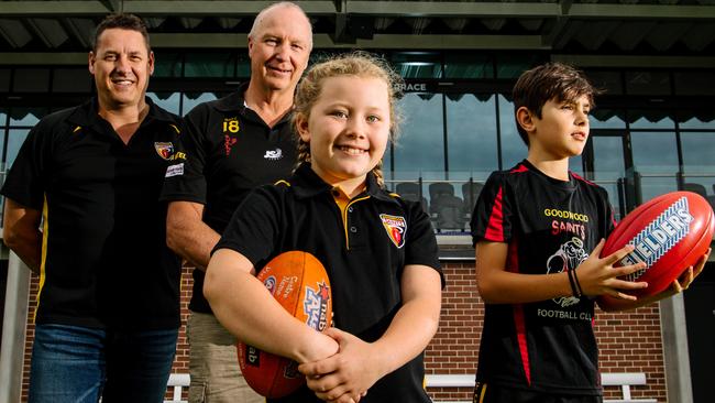 Goodwood Saints president Craig Scott (left) said the footy community needed to support inexperienced umpires. He is joined by Junior Football Director Andrew Braley (right), Holly, 9, and Harrison, 12, at Goodwood Saints Football Club, which was last year named the best junior sporting club in Australia. Picture: Morgan Sette