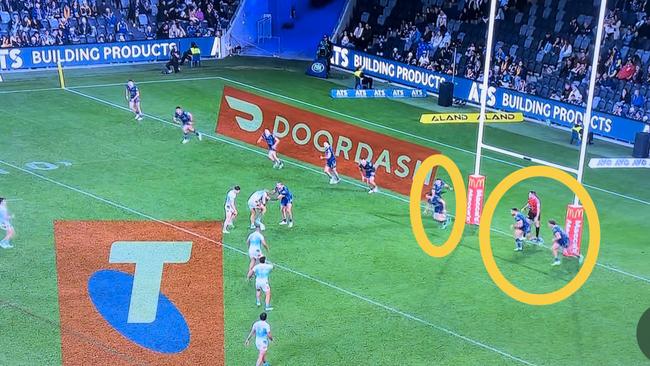 Eels players blatantly offside against the Titans.