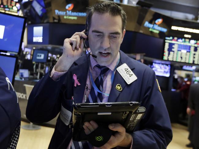 Trader Gregory Rowe works on the floor of the New York Stock Exchange, Monday, April 11, 2016. U.S. stocks opened higher on Wall Street following gains overseas as investors held out hope for more economic stimulus from China. (AP Photo/Richard Drew)