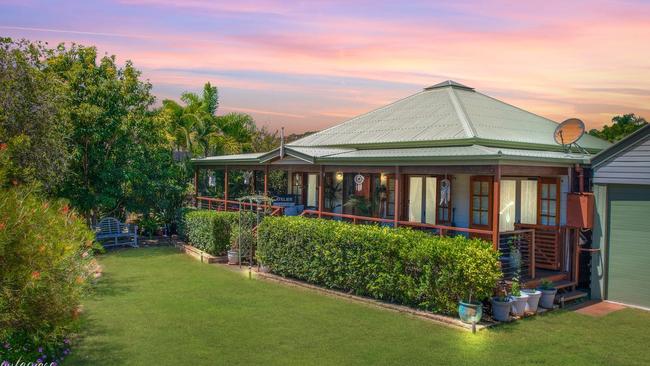 This four-bedroom house at 41 Grahame Colyer Dr, Agnes Waters, is for sale for between $879,000 and $925,000.