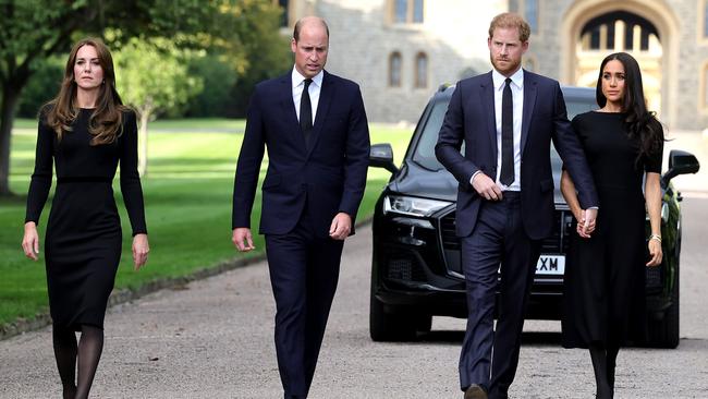 Catherine, Princess of Wales, Prince William, Prince of Wales, Prince Harry, Duke of Sussex, and Meghan, Duchess of Sussex, on the long Walk at Windsor Castle to view flowers and tributes to the late Queen Elizabeth. More moments like this are unlikely, with Prince Williams reportedly furious with his brother over claims in his memoir, Spare. Picture: Chris Jackson/Getty Images