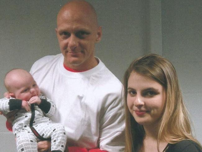 Johnson with daughter Tori and grandchild. Picture: Barwon Prison.