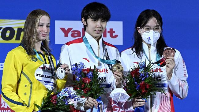 Silver medallist Australia's Mollie O'Callaghan, gold medallist China's Yang Junxuan and bronze medallist China's Tang Muhan.