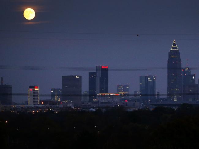 The moon rises over the banking district in Frankfurt, Germany, Sunday, Nov. 13, 2016. On Monday the so-called ‘supermoon’ will be the closest full moon to earth since 1948, and it won’t be as close again until 2034. Picture: AP Photo/Michael Probst