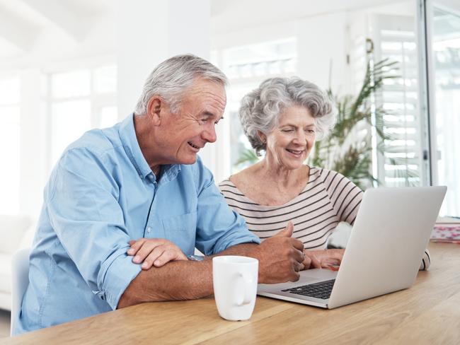 A retired couple checking their superannuation savings ahead of the upcoming changes.