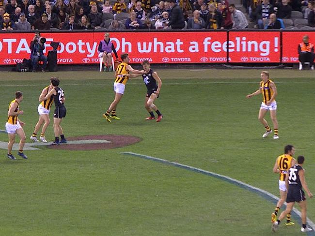 Daniel Howe jabs Patrick Cripps in the jaw.