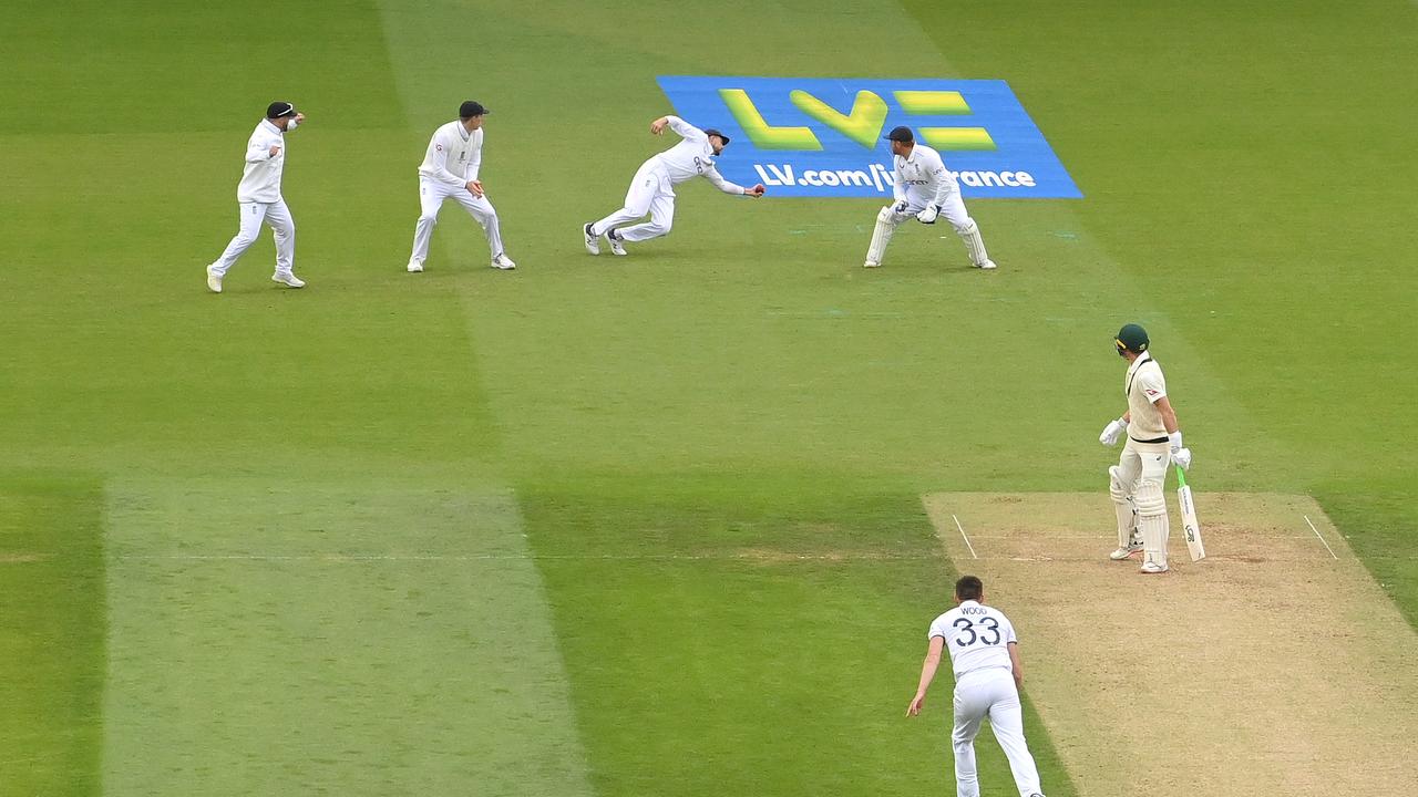 Joe Root takes a screamer to dismiss Marnus Labuschagne off the bowling of Mark Wood. (Photo by Stu Forster/Getty Images)