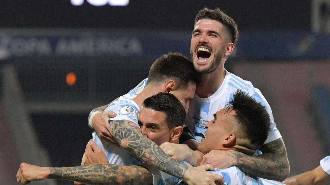 Argentina's Lionel Messi (L) celebrates with teammates after scoring against Ecuador during their Conmebol 2021 Copa America football tournament quarter-final match at the Olympic Stadium in Goiania, Brazil, on July 3, 2021. (Photo by NELSON ALMEIDA / AFP)