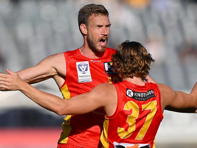 MELBOURNE, AUSTRALIA - SEPTEMBER 24: Oskar Faulkhead and Samuel Day of the Suns celebrate a goal during the 2023 VFL Grand Final match between the Gold Coast SUNS and the Werribee Tigers at IKON Park on September 24, 2023 in Melbourne, Australia. (Photo by Morgan Hancock/AFL Photos via Getty Images)