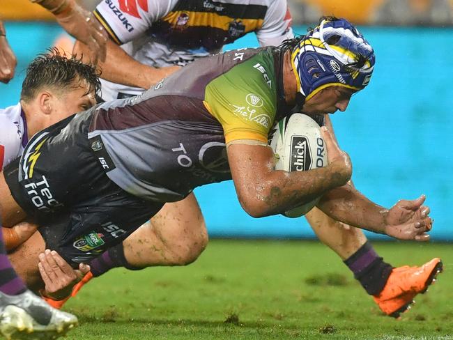 Johnathan Thurston scores a try during the testimonial match.