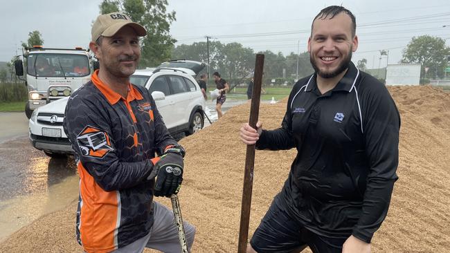 Kurt Sayed (left) from Townsville &amp; Northern Beaches Trailer Hire was one of the first to start filling sandbags at the Mount Low, (right) division 2 councillor Brodie Phillips