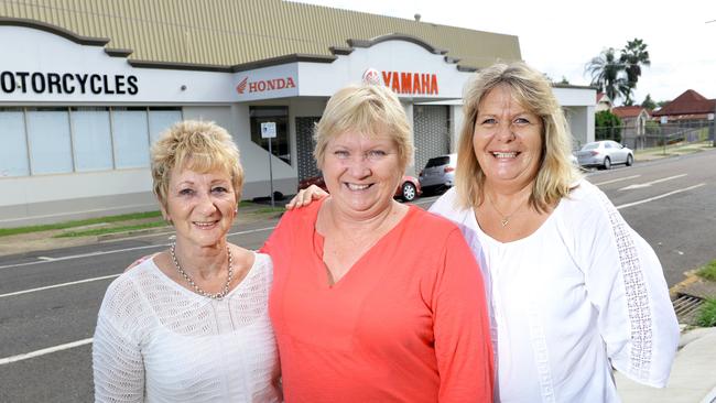 Jeannie Mair, Deb Bauer and Lynn Chandler are organising a 20th reunion for former House of Jenyns workers. The factory was in the building pictured (rear). Photo: Rob Williams / The Queensland Times