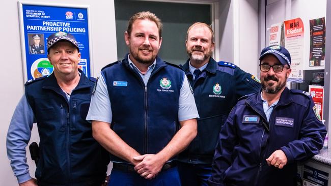 Snr Con Farrell is welcomed back by his colleagues at the Monaro PD; Senior Constable Todd McCabe, Acting Inspector Brad Hughes and Senior Constable Steve Gay. Picture: Judy Goggin