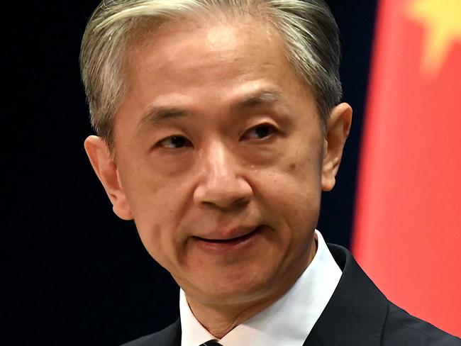 Chinese Foreign Ministry spokesman Wang Wenbin gestures during a press conference at the Ministry of Foreign Affairs in Beijing on August 8, 2022. (Photo by Noel Celis / AFP)