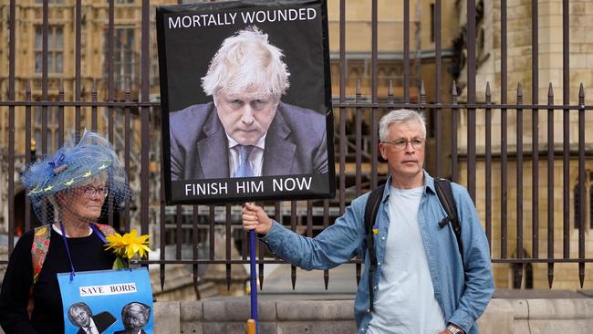 Demonstrators in front of the Commons during the no-confidence vote. Picture: AFP.