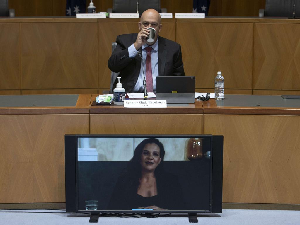 Senator Slade Brockman sips his coffee while Mel Silva from Google speaks via video during the senate inquiry into the news media bargaining code. Picture: NCA NewsWire/Gary Ramage