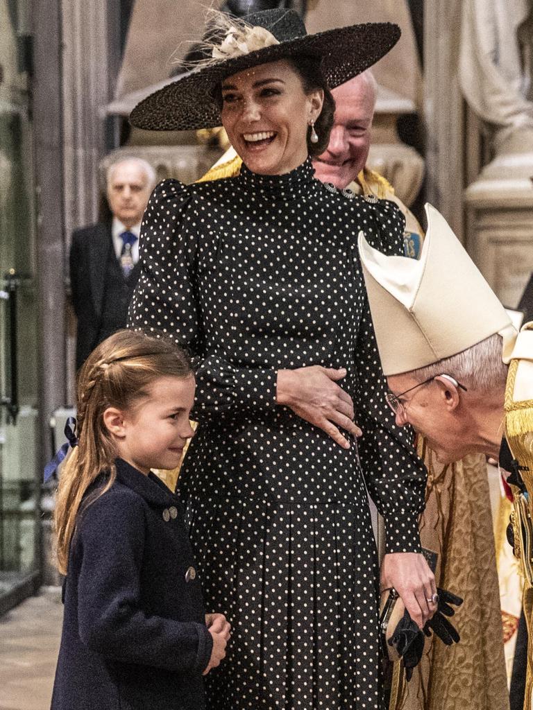 Kate Middleton laughs as she introduces Princess Charlotte to the Archbishop of Canterbury. Picture: Richard Pohle/Getty Images