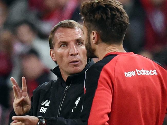 Manager Brendan Rodgers (left) gestures to Adam Lallana during the Liverpool FC training session at Suncorp Stadium in Brisbane, Thursday, July 16, 2015. Liverpool play Brisbane Roar in a friendly match in Brisbane Friday (AAP Image/Dave Hunt) NO ARCHIVING