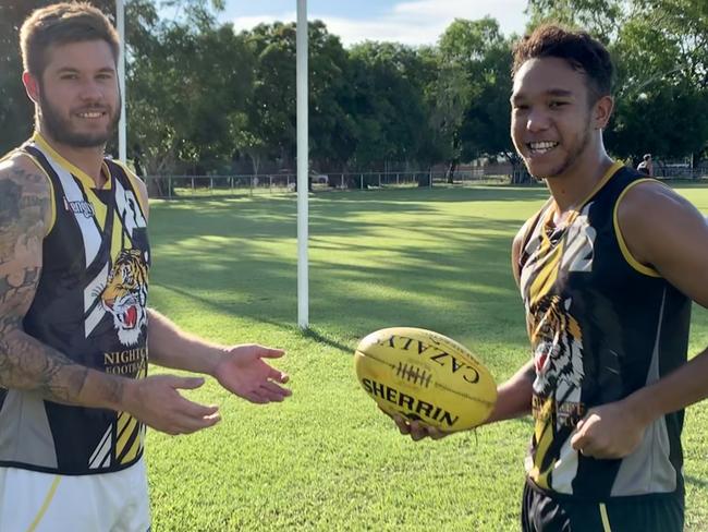 Michael Hagan (Right) hand balls to Nightcliff veteran Nathan Brown