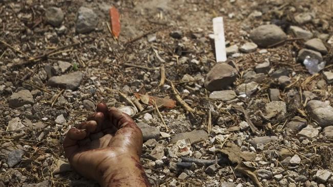 Here’s the end result of the West’s drug habits. The bloody hand of a dead man with gunshot wounds lies in a street in Tijuana, Mexico where more than 400 people were killed in drug-related violence in the city in 2008. (Pic: Guillermo Arias/AP)