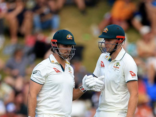 Australia's Mitchell Marsh (L) celebrates hitting a four with teammate Cameron. Picture: AFP