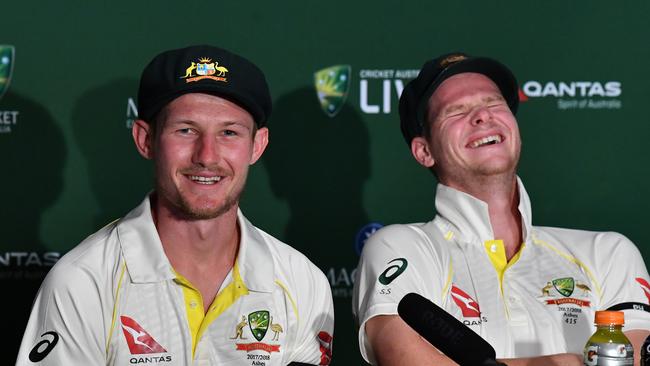 Cameron Bancroft (left) and Steve Smith (right) are seen reacting as they answer questions from the media about England wicketkeeper Jonny Bairstow.