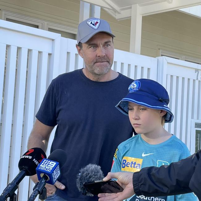 Luke Durman and 10-year-old son Leo Durman (right) speak to the media outside their home. Picture: Melanie Whiting