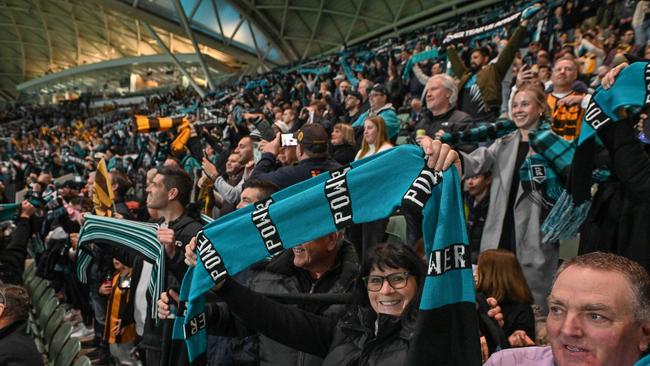 SEPTEMBER 13, 2024: Port fan Chrissie Gill during the Never Tear Us Apart anthem during the Port v Hawthorn semi final at Adelaide Oval. Picture: Brenton Edwards