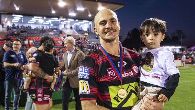 Valleys player Curtly Hammond with son Kalyn Hammond after winning the reserve grade TRL grand final in 2024. He is set to join Highfields this year. Picture: Kevin Farmer