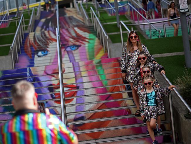 "Swifties" pose in front of the 'Swiftie Steps', a mural created by the British artist Frank Styles, outside Wembley Stadium. Picture: AFP