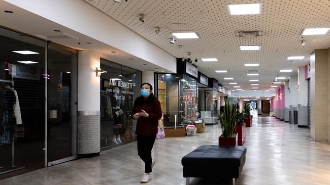 A lone person walks through an empty shopping arcade in Melbourne. Picture: Asanka Ratnayake/Getty