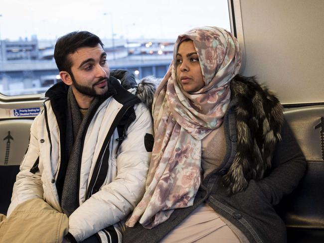 Travellers ride the AirTran to the international terminal at John F. Kennedy International Airport. Picture: AFP