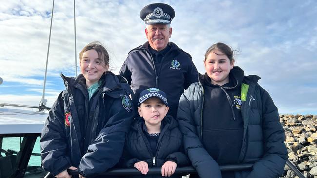 Commissioner of Police Grant Stevens and Abigail, Sergeant Sammy and Erin Scully ready to embark on a morning patrol of Port River with South Australia Police’s Water Operations Unit. Picture: SAPOL